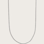 Simple silver chain necklace displayed on a light beige background.