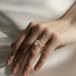 Close-up photo of a KARAAT lab-grown Oval Solitaire diamond ring in 18k yellow gold, showcasing the high-clarity stone facets and the precision of the solitaire setting