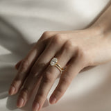 Close-up photo of a KARAAT lab-grown Oval Solitaire diamond ring in 18k yellow gold, showcasing the high-clarity stone facets and the precision of the solitaire setting