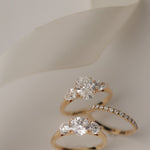 Product photography of the KARAAT Oval Trilogy in 18k white gold, detailing the precise three-stone setting.