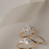Product photography of the KARAAT Oval Trilogy in 18k white gold, detailing the precise three-stone setting.