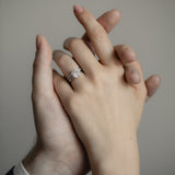 An intimate couple’s moment featuring the KARAAT Round Six Prong Solitaire engagement ring in 18k yellow gold.