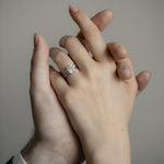 An intimate couple’s moment featuring the KARAAT Round Six Prong Solitaire engagement ring in 18k white gold.