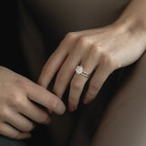 Close-up view of the KARAAT Round Six Prong Solitaire in 18k rose gold on a model’s hand, showing the secure setting.
