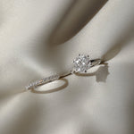 Macro photography of the KARAAT Round Six Prong Solitaire in 18k yellow gold, detailing the diamond facets and prongs.