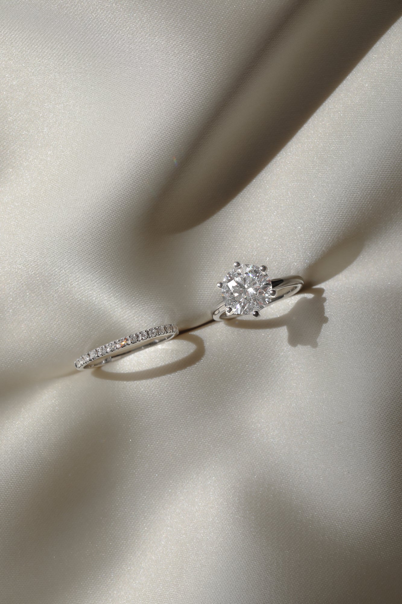 Macro photography of the KARAAT Round Six Prong Solitaire in 18k white gold, detailing the diamond facets and prongs.