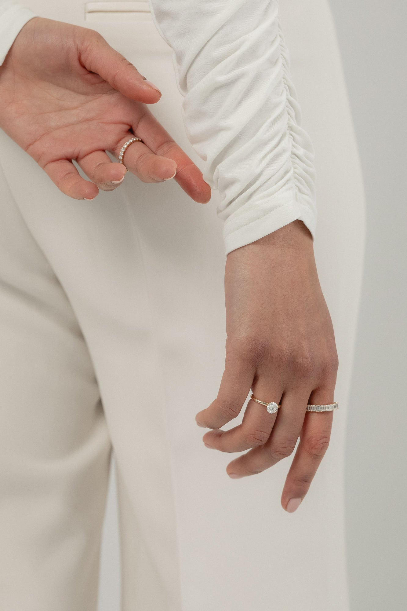 Model wearing the KARAAT Round Solitaire in 18k yellow gold, highlighting the brilliance of the lab-grown diamond on hand.