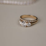 Detailed close-up of the KARAAT Round Trilogy diamond ring in 18k white gold, showing the three-stone setting.