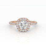A refined cushion-cut diamond with Halo in a rose gold pavé band setting.