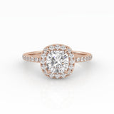 A refined cushion-cut diamond with Halo in a rose gold pavé band setting.