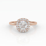 A dazzling cushion-cut diamond nestled on a sparkly halo setting and sophisticated rose gold band.