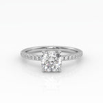 Elegant Cushion Solitaire Engagement Ring with sparkling pavé band shown in white gold.
