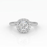 A gleaming cushion-cut diamond engagement ring set in elegant solitaire with halo style.
