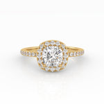 A captivating cushion-shaped diamond engagement ring with a luxurious Halo and Pavé band design.